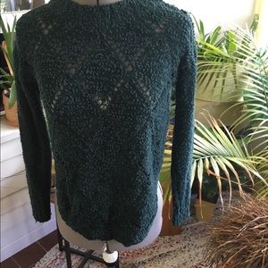 Maurice’s dark teal sweater